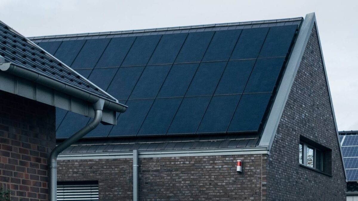 A house roof completely covered by a solar panel