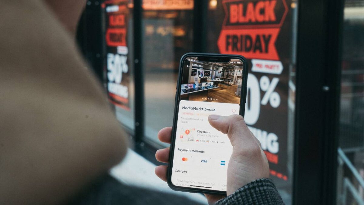 Person using a smartphone in a shopping mall