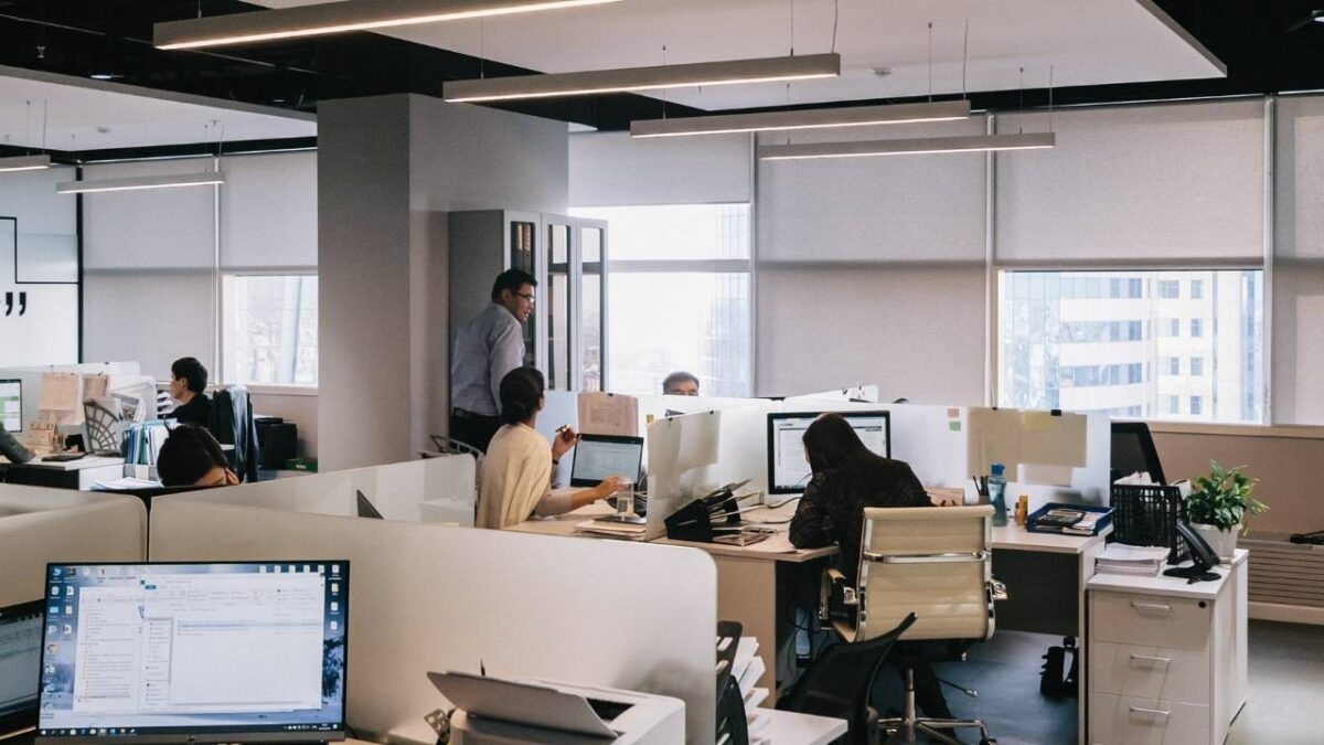 A modern, well-lit workspace with a cubicle layout