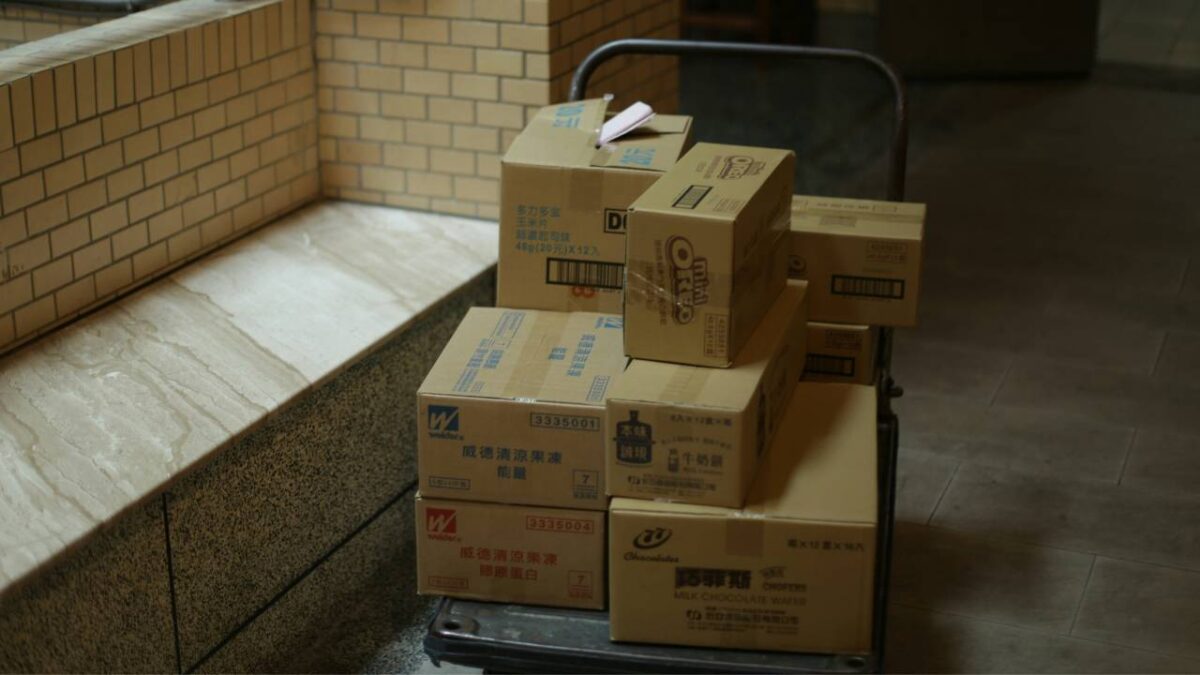 Several carboard boxes placed on a wheel cart