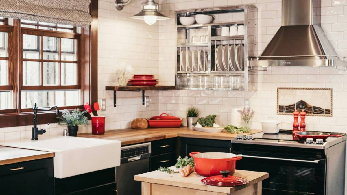 A modern kitchen space with a few red elements