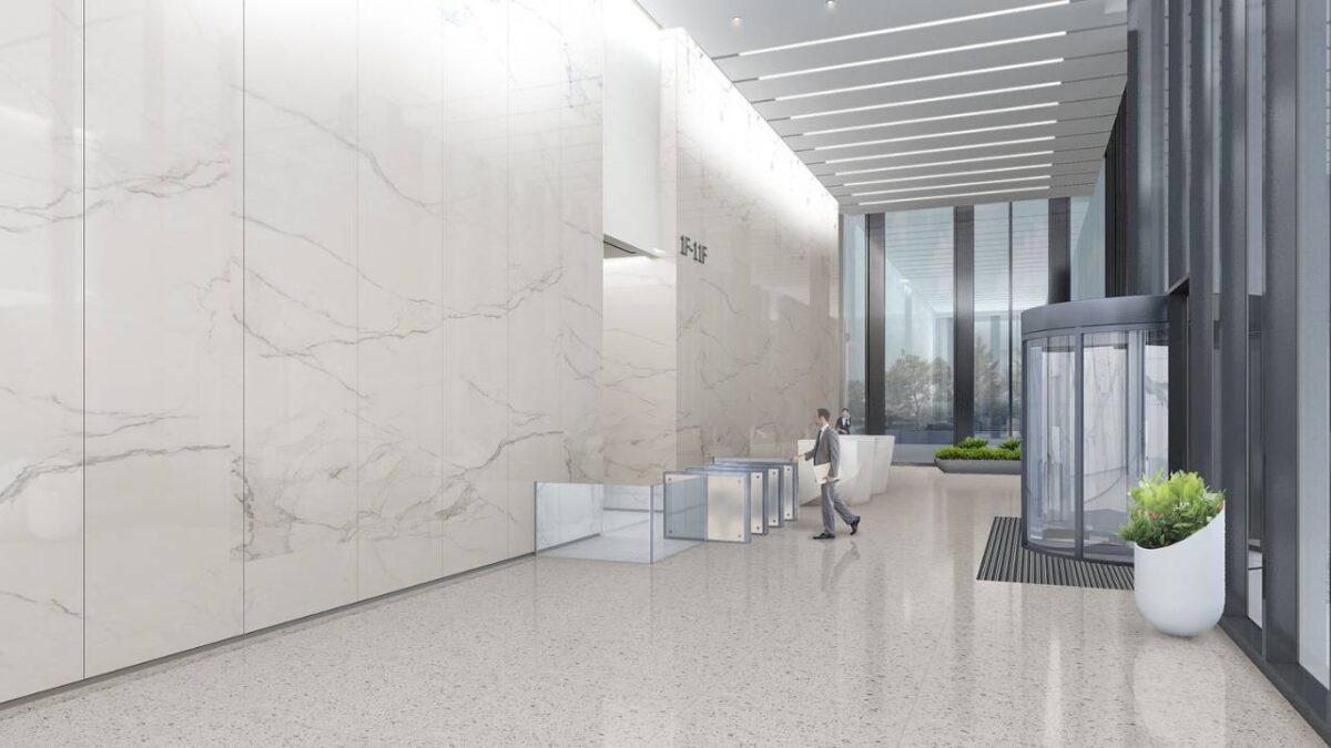 A spacious corporate lobby with stone walls