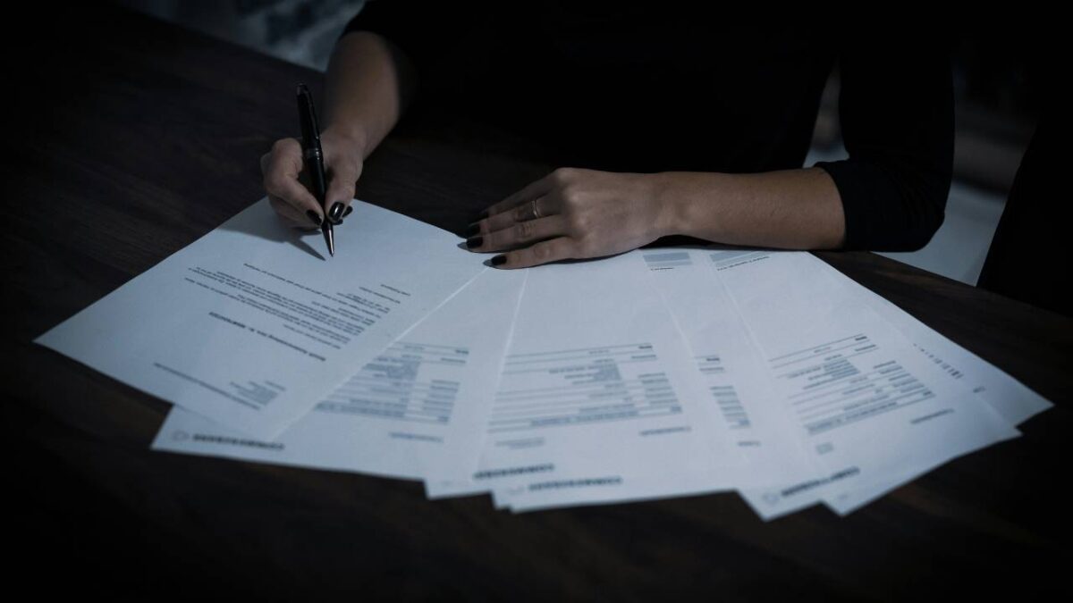 A woman filling up important paperwork